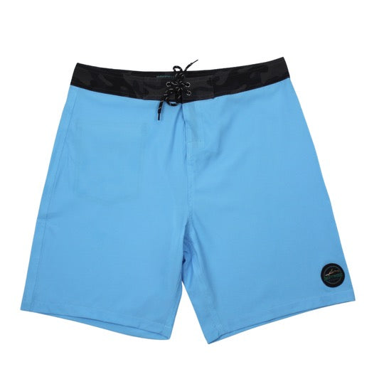 Light blue boardshorts with a black camo waistband and black camo back pocket, featuring a subtle black Driftwood Apparel logo.